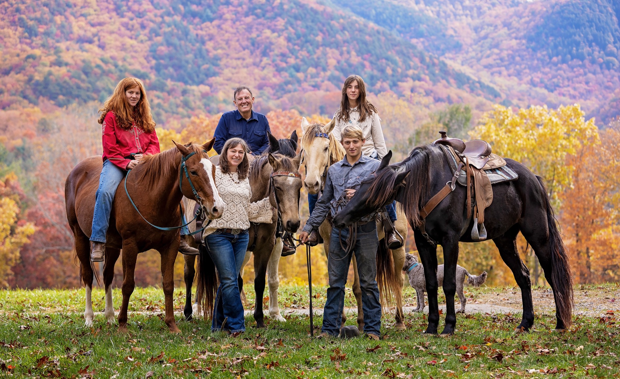 The Harborwood Farm family with their horses in the Blue Ridge mountains in autumn